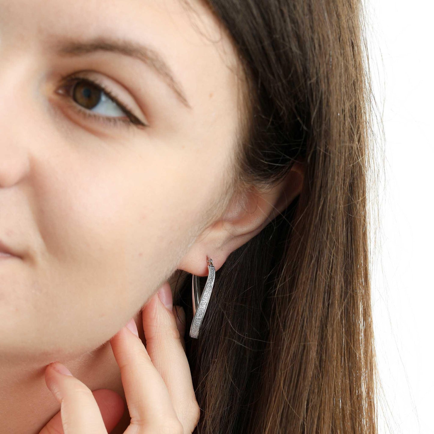 White Gold Glitter Oval Twist Hoop Earrings